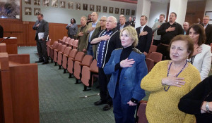 Mr. Weissman, third from right, is a fae in the crowd as he leads Pledge of Allegiance