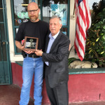 Lions President Dick Sharpe, at right, presents the Lions Club Award of Excellence to Albert Vera Jr.