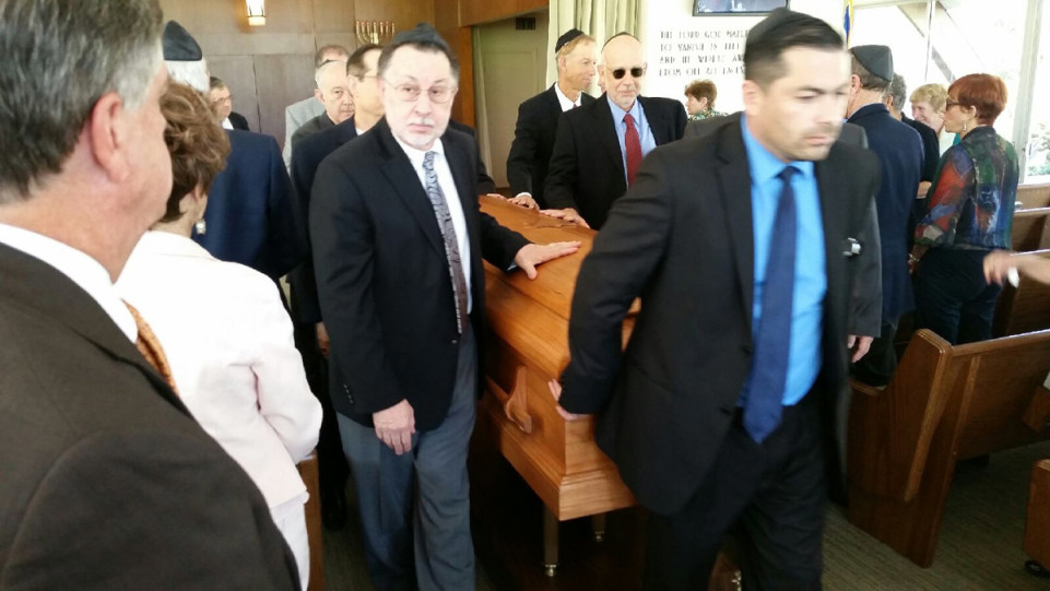 Pallbearers remove Mr. Kronenthal’s casket this afternoon following funeral service at Hillside Memorial Park.